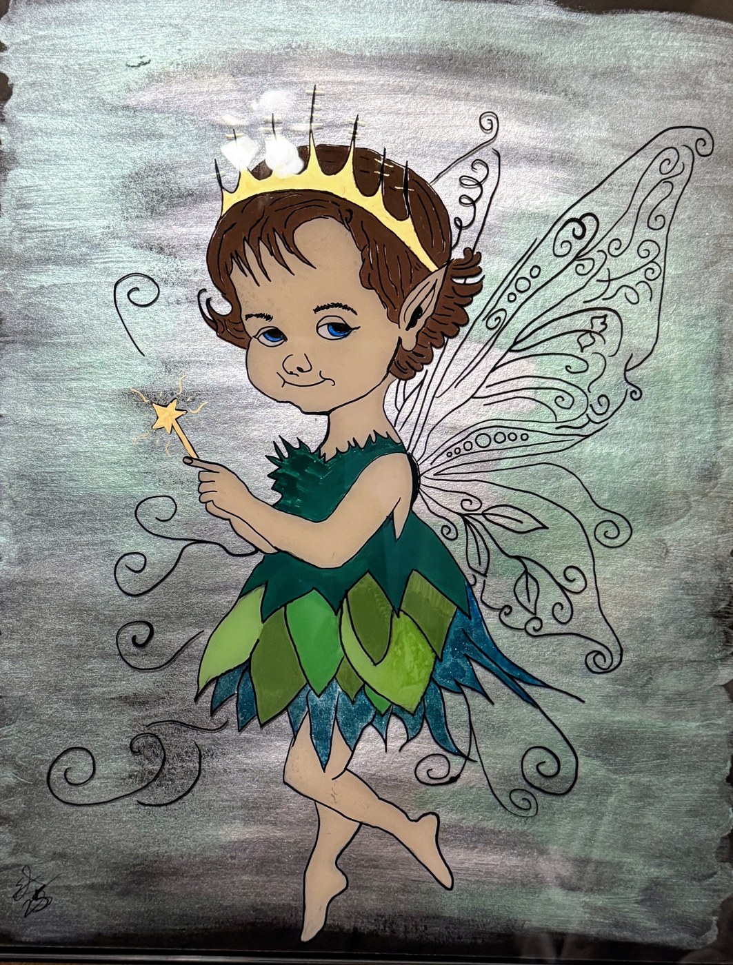 A crowned boy fairy in a green leaf dress holding a lit star wand