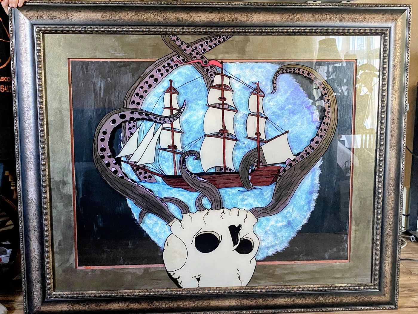 A tall ship beset by kraken tentacles rising out of a skull